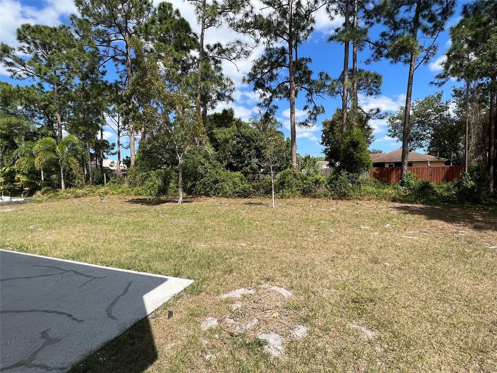 Photo of 3661 SW Europe Street, Port Saint Lucie, FL 34953 (MLS # F10420339)