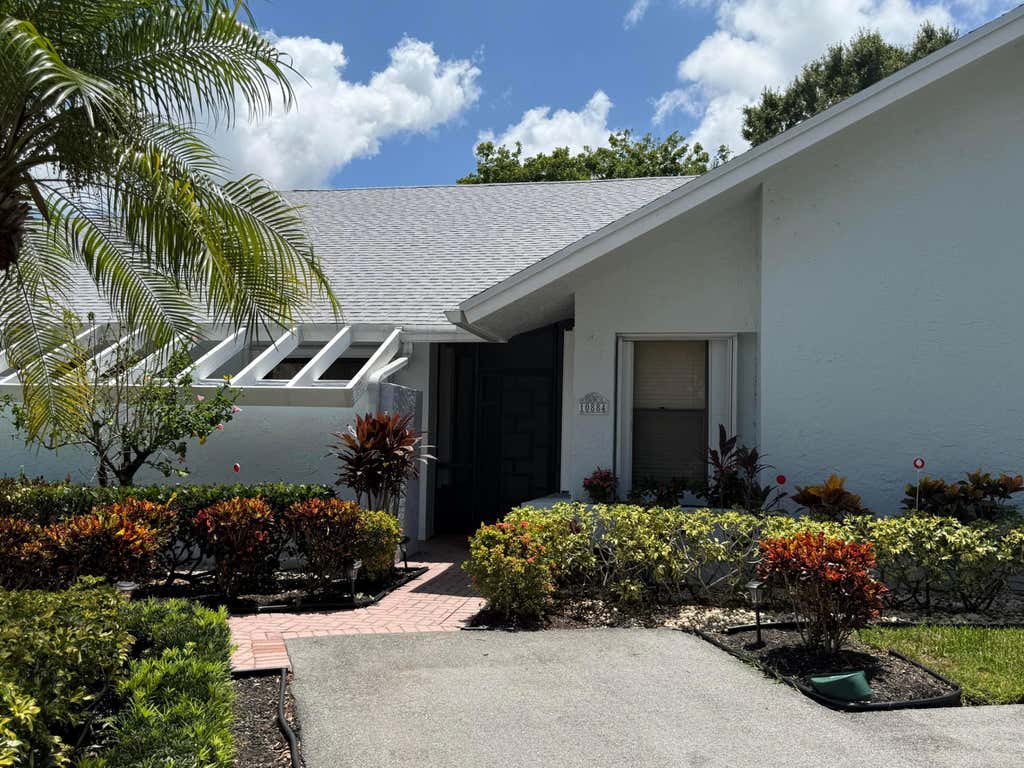 Photo of 10884 LAKE FRONT Place, Boca Raton, FL 33498 (MLS # B26064563)