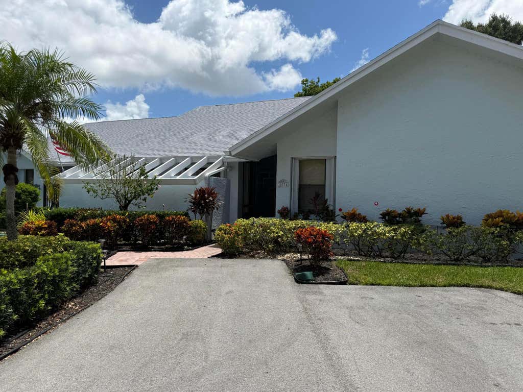 Photo of 10884 LAKE FRONT Place, Boca Raton, FL 33498 (MLS # B26064563)