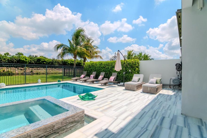 Welcome to one of the most impeccably crafted homes in Lotus. Completely reimagined and rebuilt with NON-GL finishes, this residence was taken down to the cinderblocks and was adorned with premium details throughout. No expense was spared, with an integrated Aroma360 scent system, advanced UV air purification, and whole-home water filtration for the ultimate move-in ready experience. The chef's kitchen boasts imported cabinetry and top-tier appliances. Set on one of Lotus's most private lots, enjoy tranquil canal views with no rear neighbors and the option to extend the backyard fence. Residents have access to a 26,000 sq ft clubhouse with pools, lounges, fitness center, indoor basketball, pickleball, tennis, game room, and restaurant. Experience luxury living at its finest