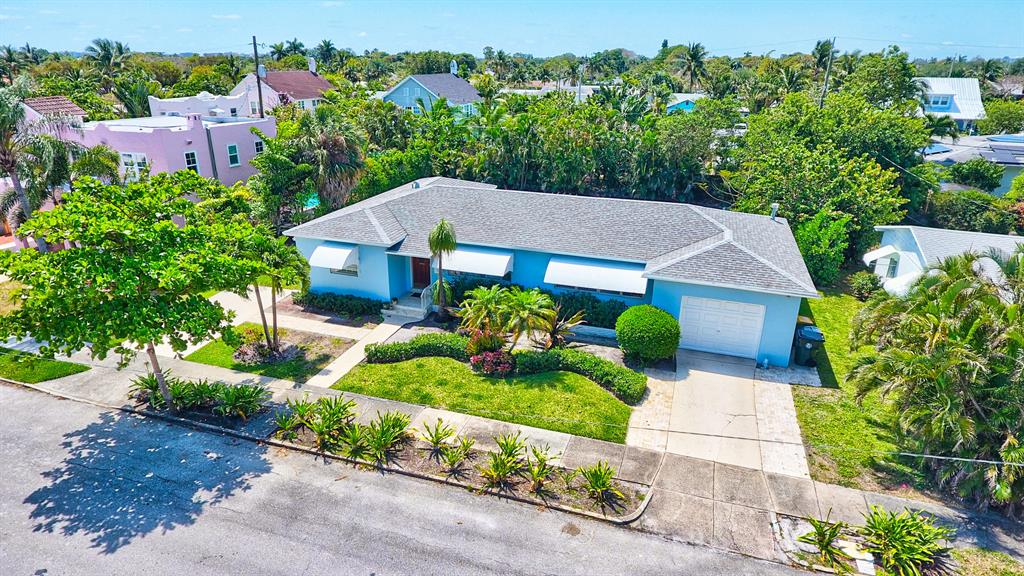 Lake Worth Beach's Best....Historic College Park, a tranquil neighborhood with architecturally significant homes, beautiful landscaping and the best of Florida living. Pets case by caseThis charming mid-century home offers a gracious floorplan, hardwood floors, new granite kitchen, formal living and dining rooms, family room, separate office, 2 large bedrooms. 1 plus baths, 1 plus car garage and laundry. Office can be 3 bedroom.The backyard is private with a wall of palms and large deck perfect for outdoor gatherings.The area offers shops, restaurants, live theatre, cafes, art galleries, public golf, a local beach and fishing pier. Enjoy The Flagler and Norton Museums, Four Arts, Dreher Zoo.