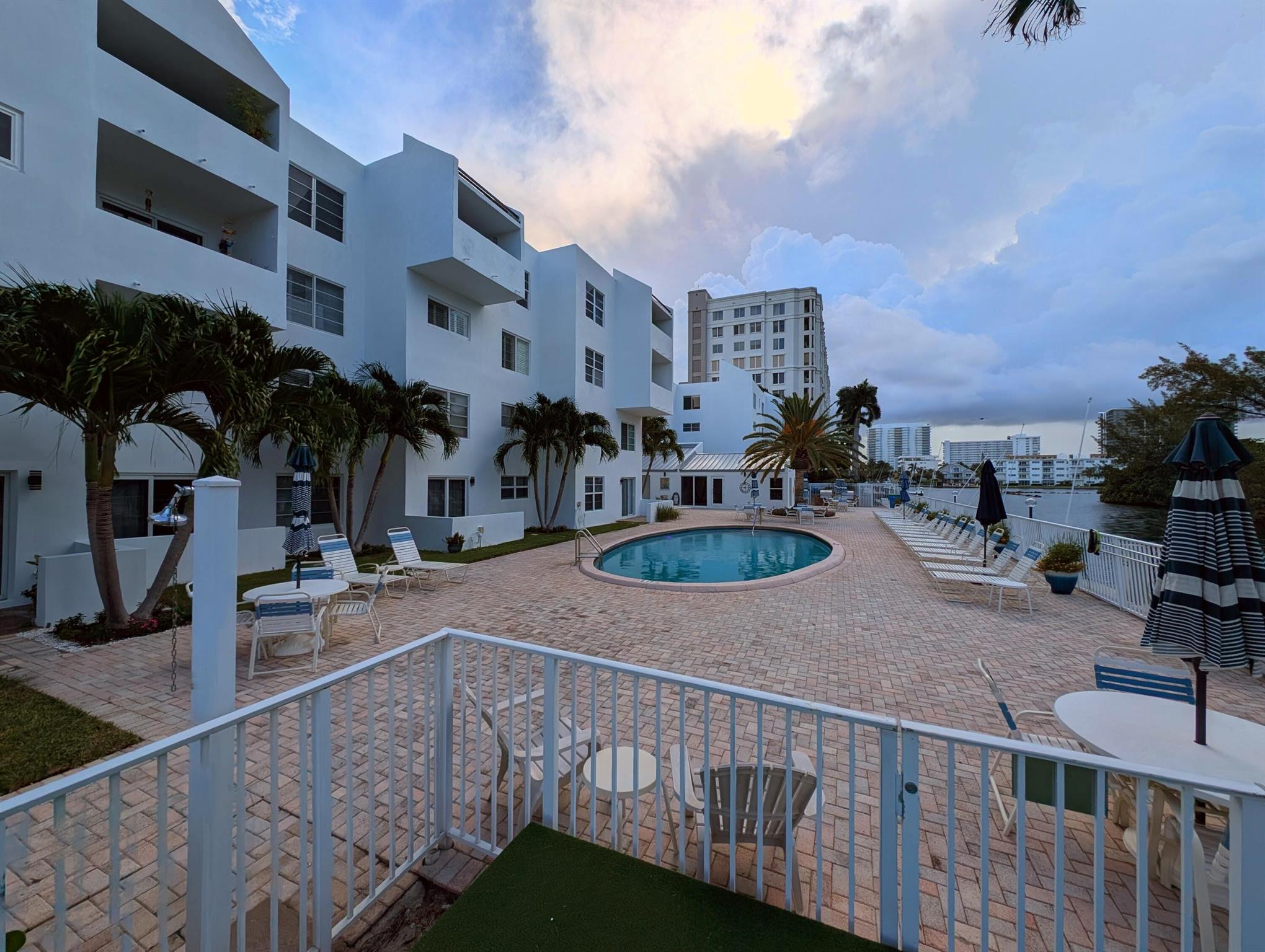 Bring your boat and live the Intracoastal lifestyle! No stairs on this first floor unit that leads directly out to the pool and ICW. No fixed bridges and boat slips available for up to 46ft! Don't own a boat, yet? Take the free Circuit electric shuttle over to restaurants and beaches!Across the canal is a Mangrove park so the views will be preserved.The unit is a 2 Bed, 2 bath basic unit. AC replaced in late 2020, so its ready to go as is or make it your way. Master bedroom opens to the community pool, clubhouse, and grills.Ready to move in - furniture negotiable.See it today!