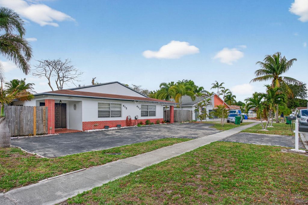 Photo of 415 SW 61st Terrace, Margate, FL 33068 (MLS # B26002826)