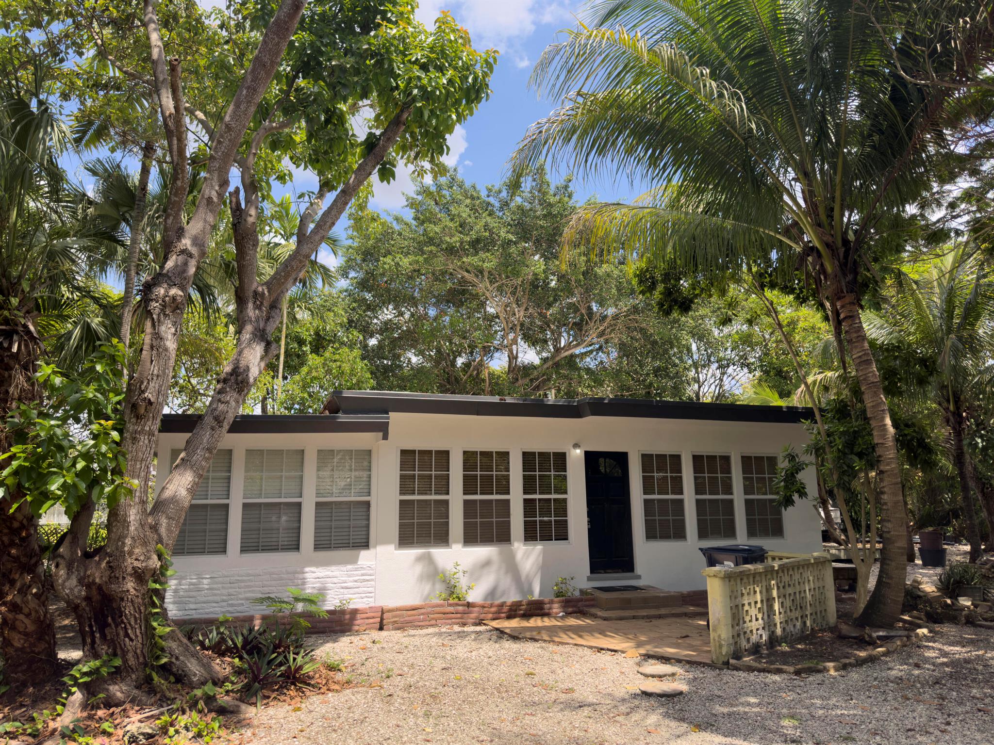 Cozy 2-bedroom, 1-bath home featuring a spacious Florida room currently used as a third bedroom. Ideal for University of Miami students or family--just a short walk or bike ride to the UM Main Campus and the Frost School of Music. Pet-friendly for both dogs and cats. Enjoy a large, secluded backyard with mature avocado trees, offering a private and peaceful outdoor space. The oversized lot provides ample parking. The East side yard will be reserved for landlord use and is fenced off for privacy. Water and Yard care are included in the rental price.