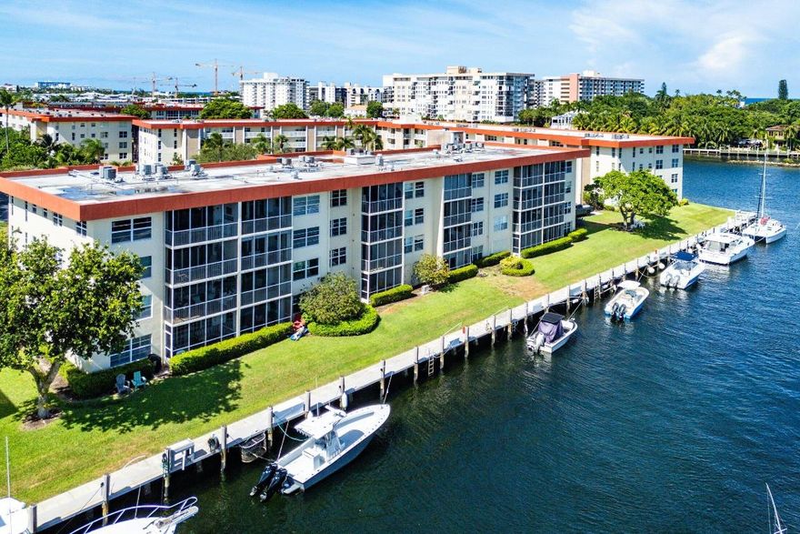 Come experience Palm-Aire - fresh off a multi-year restoration, 50 Year review completed, NO Assessments, FULL reserves - Peace of Mind! This beautiful top floor 2 bedroom 2 bath has great views of the ICW & canal, sunny South facing private balcony and is being sold furnished. Impact Windows & Sliders, Hardwood floors throughout, 2 en-suite bedrooms, washer/dryer in condo (plus community laundry on the floor). Bring your EV/Hybrid car - RARE - has an Electric Charger! Enjoy resort style pool & clubhouse right on the intracoastal, HOA fee covers High speed internet/cable, water, trash, plus more... Boat dockage (when available) at $3 per foot - deep water access to 2 inlets. First time this condo is available in almost 30 years - don't delay and have to wait again!