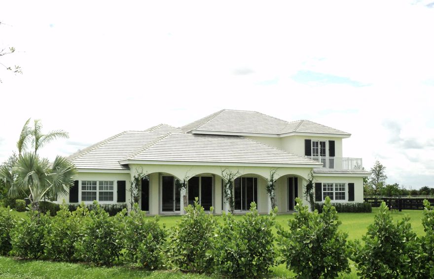 New construction - ready for occupancy!Custom built 2 story estate home with 4 bedroom , 3.5 bath and a detached 1/1 guest suite. Home features marble & wood floors ,double ovens, spacious loft living area on upper level and a large covered patio.18 stall barn with 2 grooms apartments ,4 grooming stalls, 4 wash stalls,140 x 230 riding arena and 8 paddocks on 4.97 acre lot. Located in Wellington classic Estates, this private equestrian community has 10 lots and features gated entry, interior bridle trails, paved roads, a tranquil lake and lush landscaping. WCE is conveniently located to all Wellington equestrian venues and the Village of Wellington bridle trail system. Add the lot next door for a total of 9.34 acres!