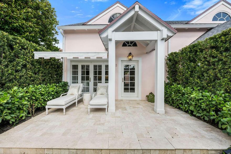 This exceptional in town villa is a rare offering--modern, refined, and situated just one block from Worth Avenue and the beach, with easy access to the Lake Trail, restaurants, and shopping.Thoughtfully updated, the one-bedroom, one and a half bath residence offers 1,072+/- square feet of total living space with hardwood floors throughout. The main level features a well-proportioned living area, a streamlined kitchen, a powder room, and private outdoor space that extends directly from the living room, enhanced by an awning for shade and privacy.The second level is dedicated to the primary suite, complete with a full bath, walk-in closet, and built-in office area. Additional features include impact windows and doors, custom cabinetry, plantation shutters, and an in-unit washer and