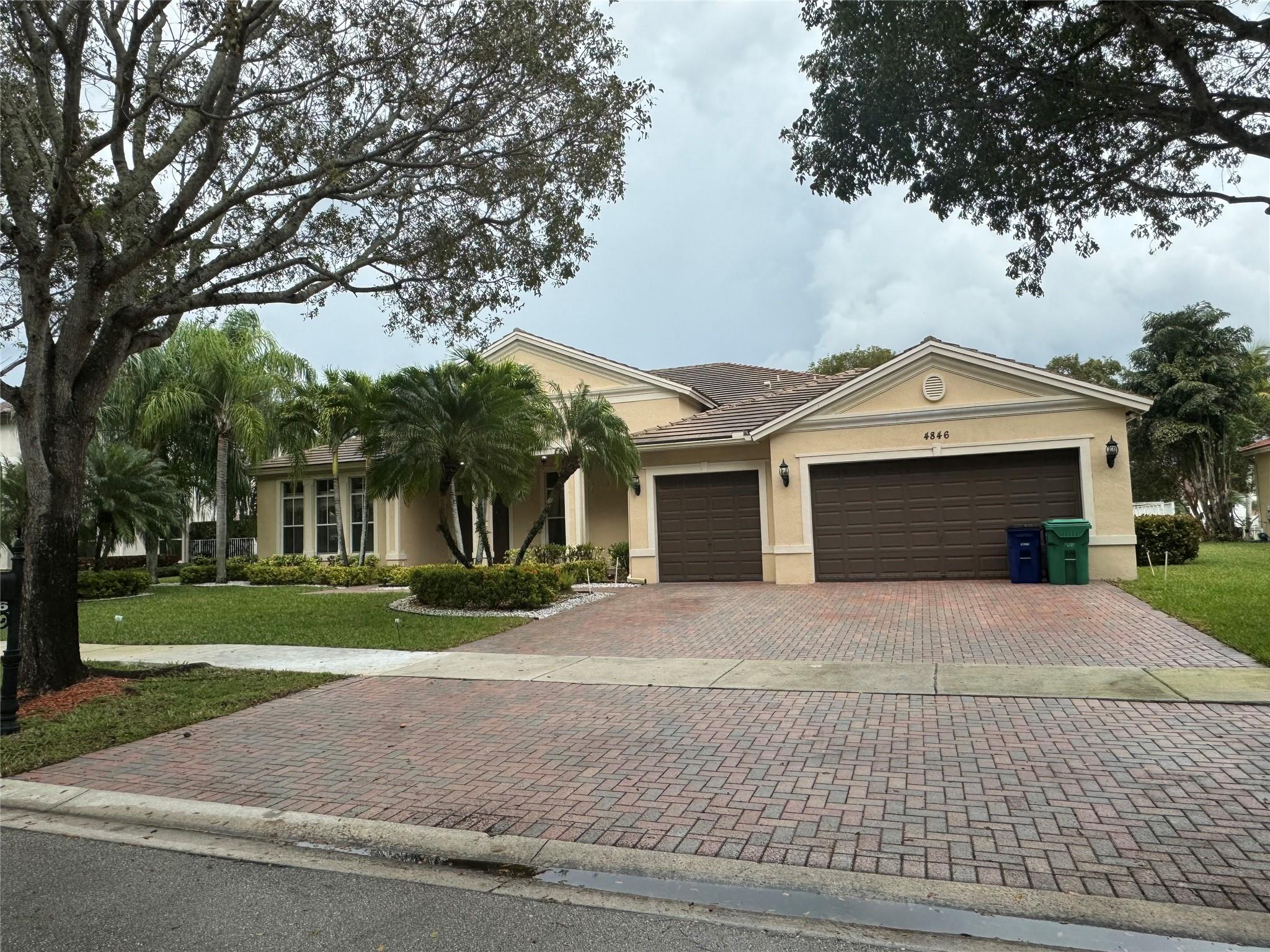Exceptional Location! This waterfront 6 bedroom Tangelo model is situated in a highly sought-after residential community of Hibbs Grove in Cooper City. The home boasts vaulted ceilings with an open floor plan and 5 bedrooms, a fully furnished office, and 3.5 bathrooms. The residence showcases an updated kitchen with granite countertops, stainless steel appliances, 42-inch cabinetry, and a spacious pantry. The split floor plan offers captivating views of the water from the Main bedroom, living area, and kitchen. The expansive covered patio and backyard is ideal for children and relaxation.