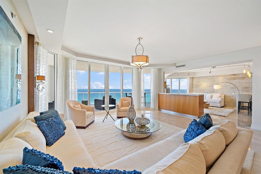 1601A The rarely available 01 line. Never miss a Sunrise or Sunset when you walk into this sprawling direct ocean front unit that is modernly Decorators Designed. This unit is truly TURNKEY! Marble flooring, 3 bd 3.5 bath and a beautifully decorated office/den with its intercostal view. Wake up in your master bedroom looking directly onto the OCEAN!  Beautiful light fixtures with an automation system and a remotely concealable TV. Both ocean and intercostal views. Three terraces throughout,this unit has never been rented and shows pristine.The Ritz Carlton is comprised of two 27-story towers, which house 242 condominium and resort residences. Amazing amenities and restaurant, private beach and stunning pools.. Bike &private storage and pet areas! Resort living at its finest