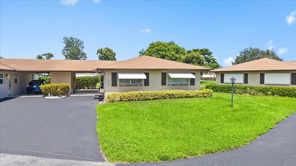 Photo of 122 Mockingbird Lane, Delray Beach, FL 33445 (MLS # B26073886)
