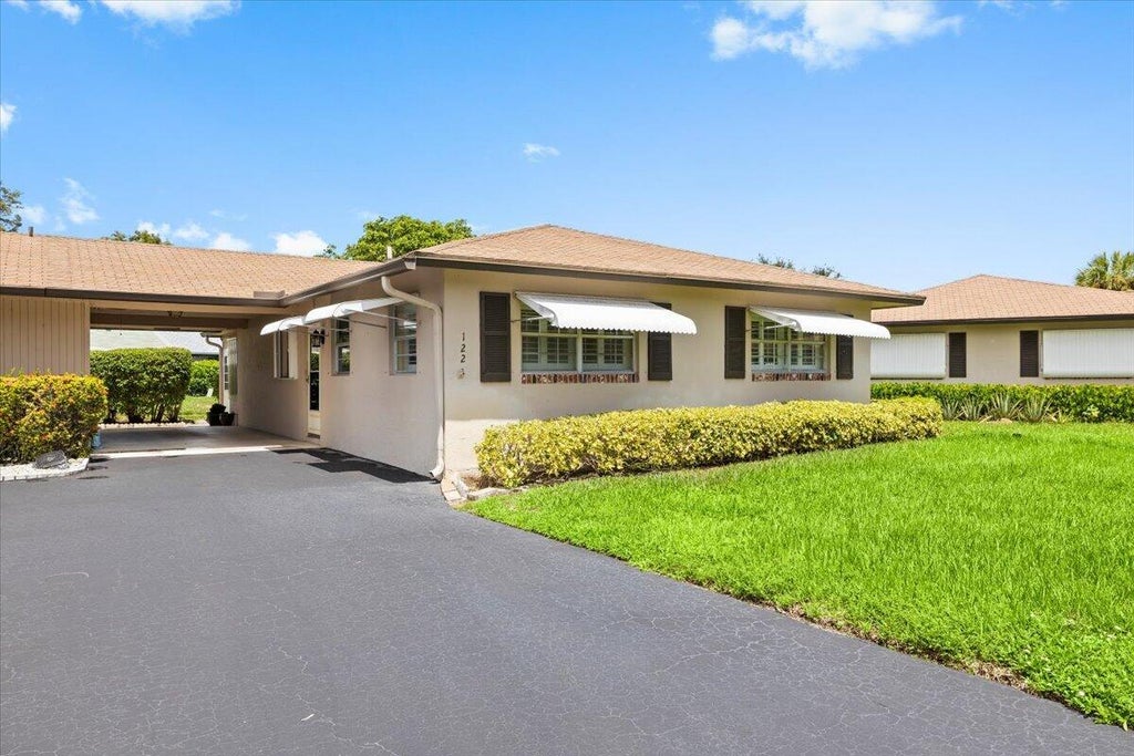 Photo of 122 Mockingbird Lane, Delray Beach, FL 33445 (MLS # B26073886)