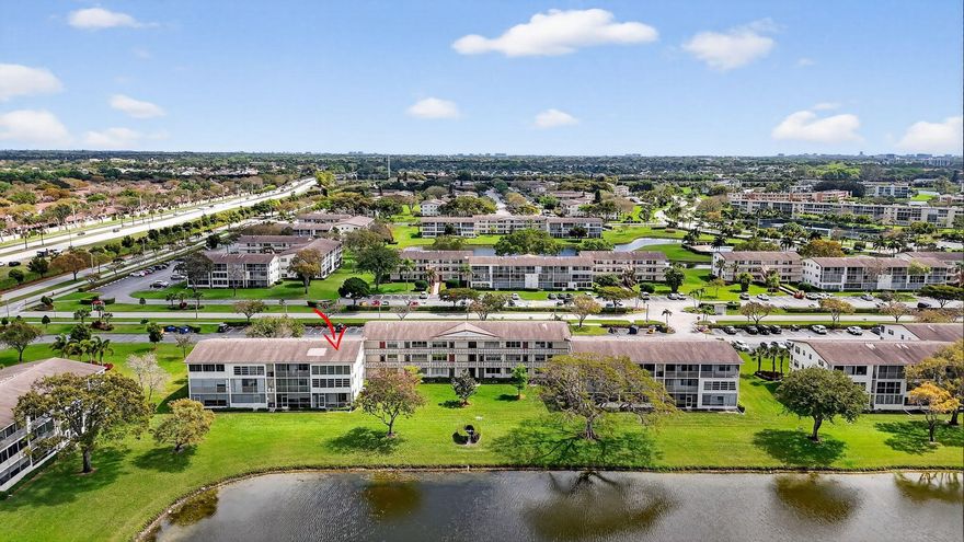 WOW - Top Floor, Corner Unit 2/1.5 condo with serene lake views and central air conditioning. Watch the sunset over the water from your spacious private balcony. No wallpaper or carpet to remove!  Lots of storage including a closet on the balcony. The building has an elevator and there is a satellite pool in the community. Located in Century Village Boca Raton, a man gated, 55+ community with amenities galore - renovated clubhouse, state of the art theater, indoor/outdoor pools, exercise rooms, tennis and pickleball courts, and plenty of paths throughout the community with lots of green space. A courtesy bus provides transportation within the community as well as to local shops and restaurants. You will never be bored with tons of classes, shows, and activities!