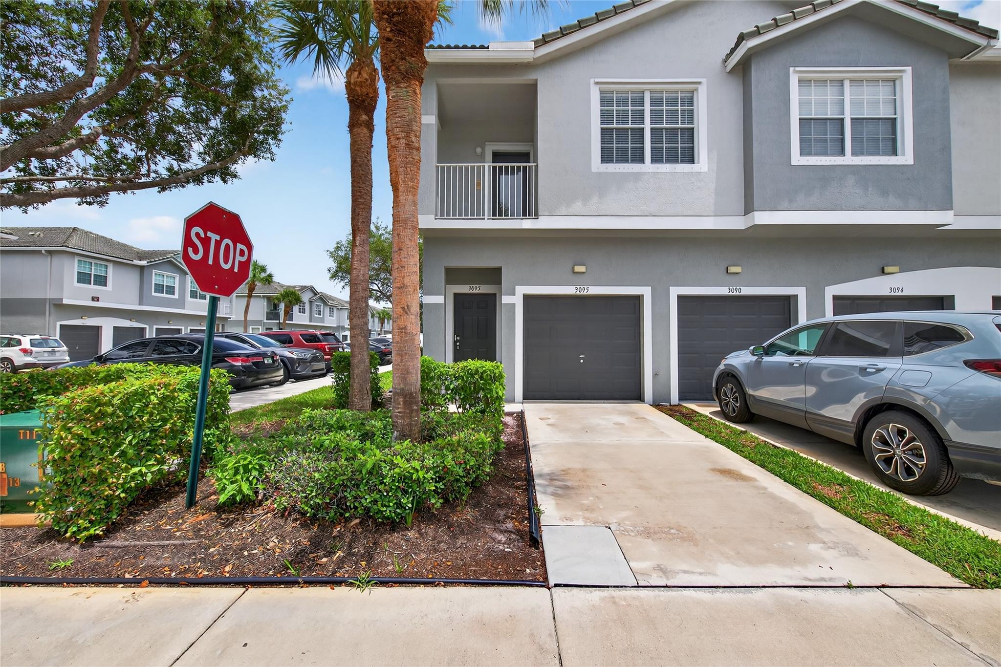Rarely Available 3095 Grandiflora Dr in Greenacres! This well-maintained 2-bedroom, 2-bath townhome is located in the gated community of Magnolia Bay and features a spacious open layout, modern kitchen with stainless steel appliances, in-unit laundry, and a 1-car garage with additional driveway parking. Enjoy community amenities like a pool and playground, all just minutes from shopping, dining, and major highways. Pet-friendly with approval—schedule your showing today! (Note Some photos may be virtually staged)
