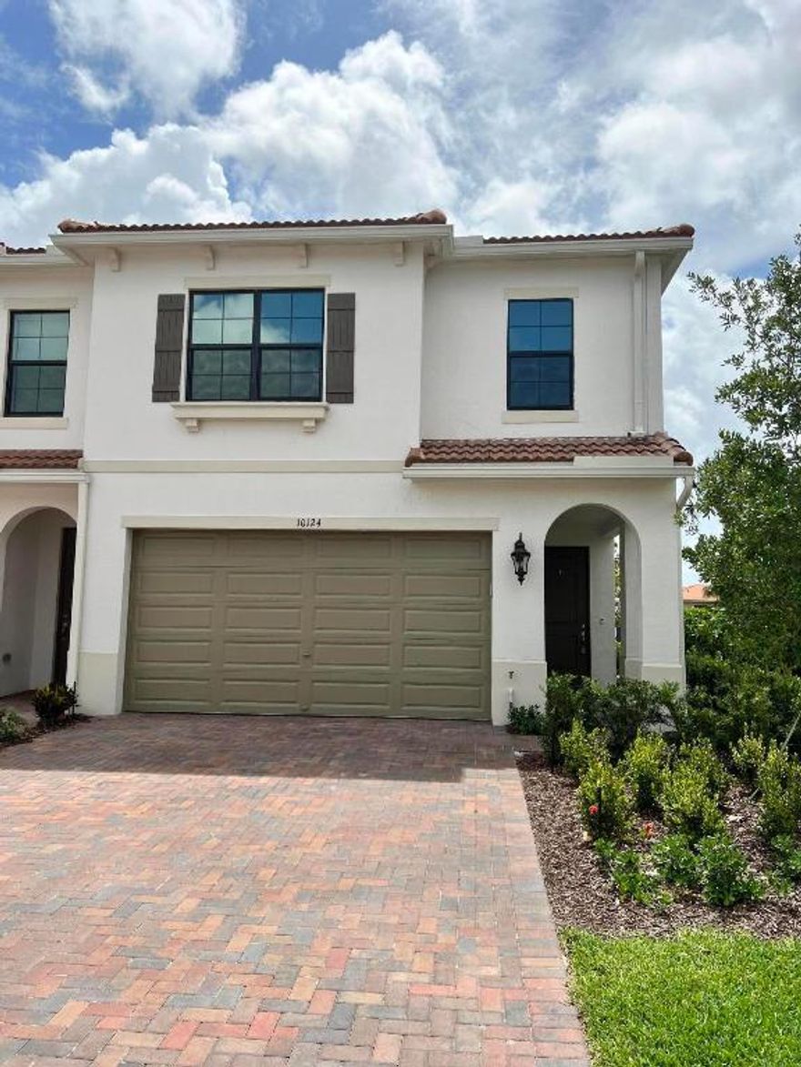 Stunning 3 bedroom 2.5 bath end unit built in 2021. Gated community of Enclave at Boca Dunes. Boasting high-end finishes, IMPACT WINDOWS and gorgeous waterfront view. This corner unit townhome with extra side windows both upstairs and down, is move-in ready with the first floor highlighting a beautiful open floor plan with marble floors plus a guest half bath. In addition, there are numerous builder and homeowner upgrades and enhancements including stainless steel appliances with double ovens, a reverse osmosis water filter, custom kitchen cabinets with quartz countertops, a tiled backsplash, and ceiling fans throughout. Right next door to the COMMUNITY POOL & GYM