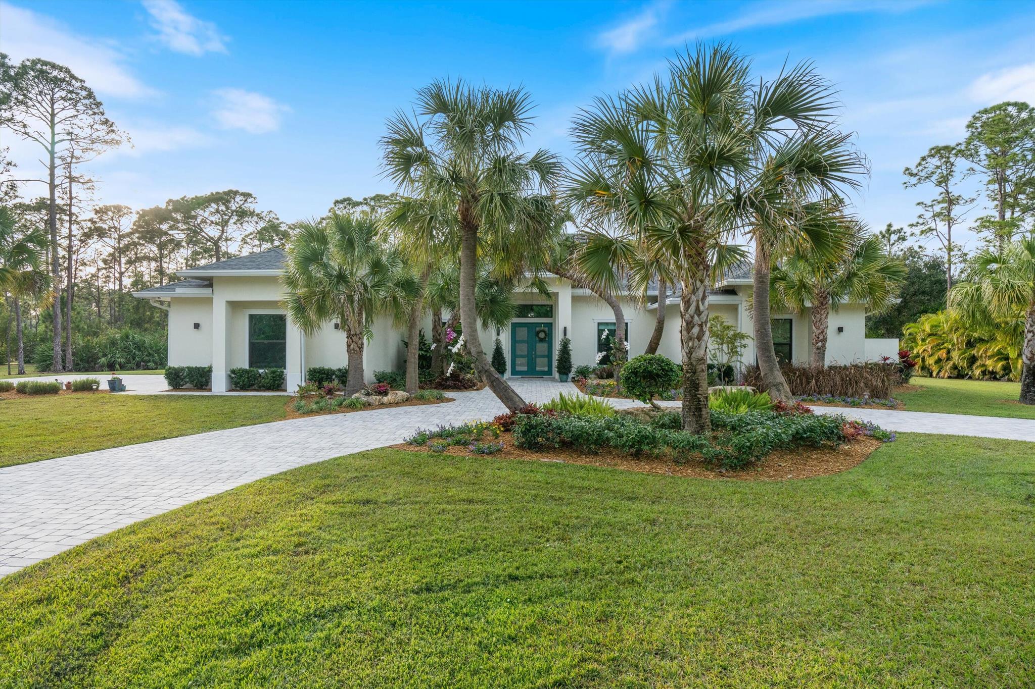 Discover unparalleled elegance in this recently built 5 bedroom, 4 bathroom, 5+ acre oasis in Caloosa. Nestled on a lush private landscape adorned with mature trees and fruit bearing plants, this home offers a park-like setting where luxury abounds.The expansive outdoor living area is a true entertainer's dream boasting an electric screened porch and gazebo that blend indoor and outdoor spaces. Enjoy lounging in the pool and hot tub. Inside, the thoughtfully designed floor plan provides ample space for both comfort and privacy.This home is MOVE IN READY so enjoy this exquisite home.