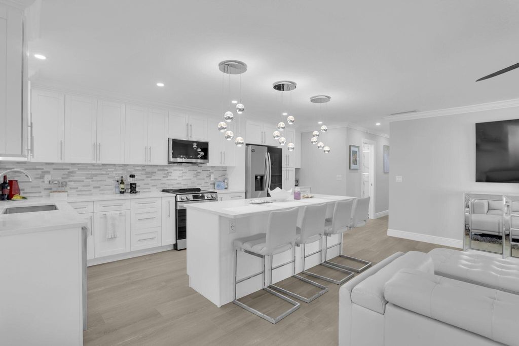 Photo of 540 High Point Drive #A, Delray Beach, FL 33445 (MLS # R11132008)