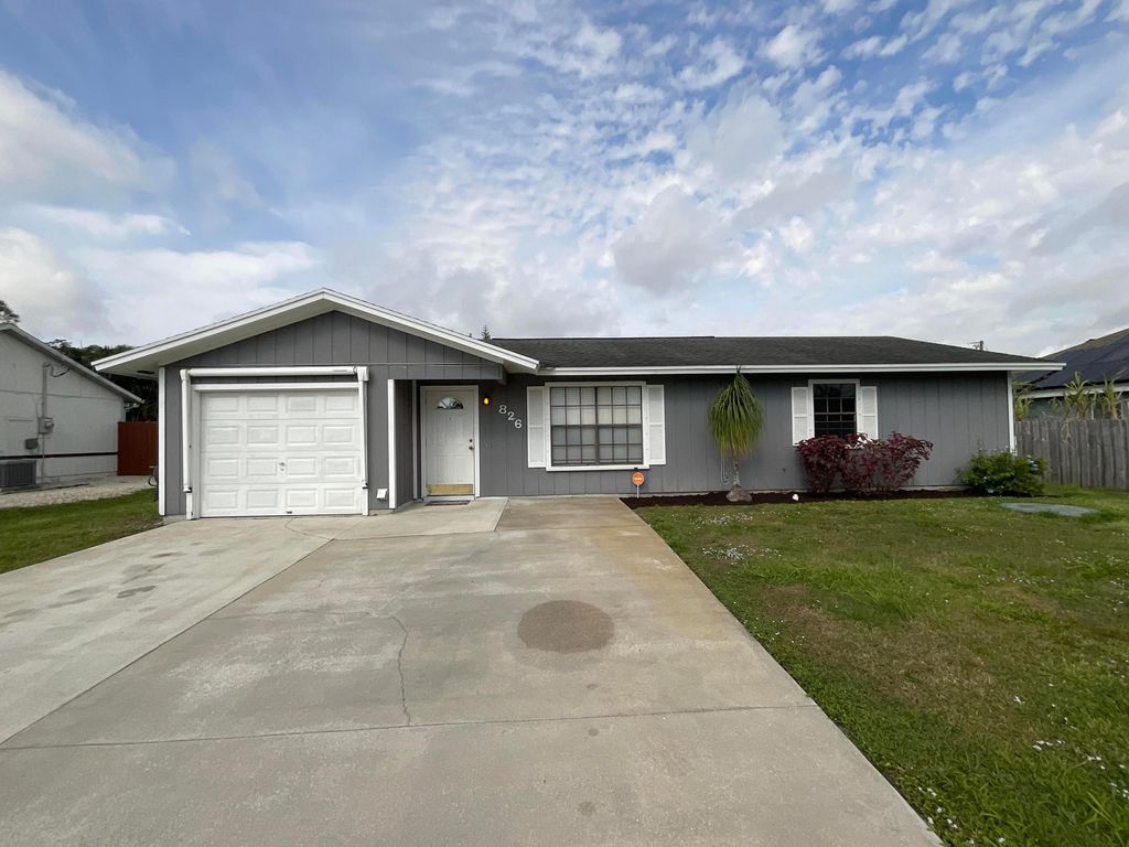 Photo of 826 SW Curtis Street, Port Saint Lucie, FL 34983 (MLS # R10968581)