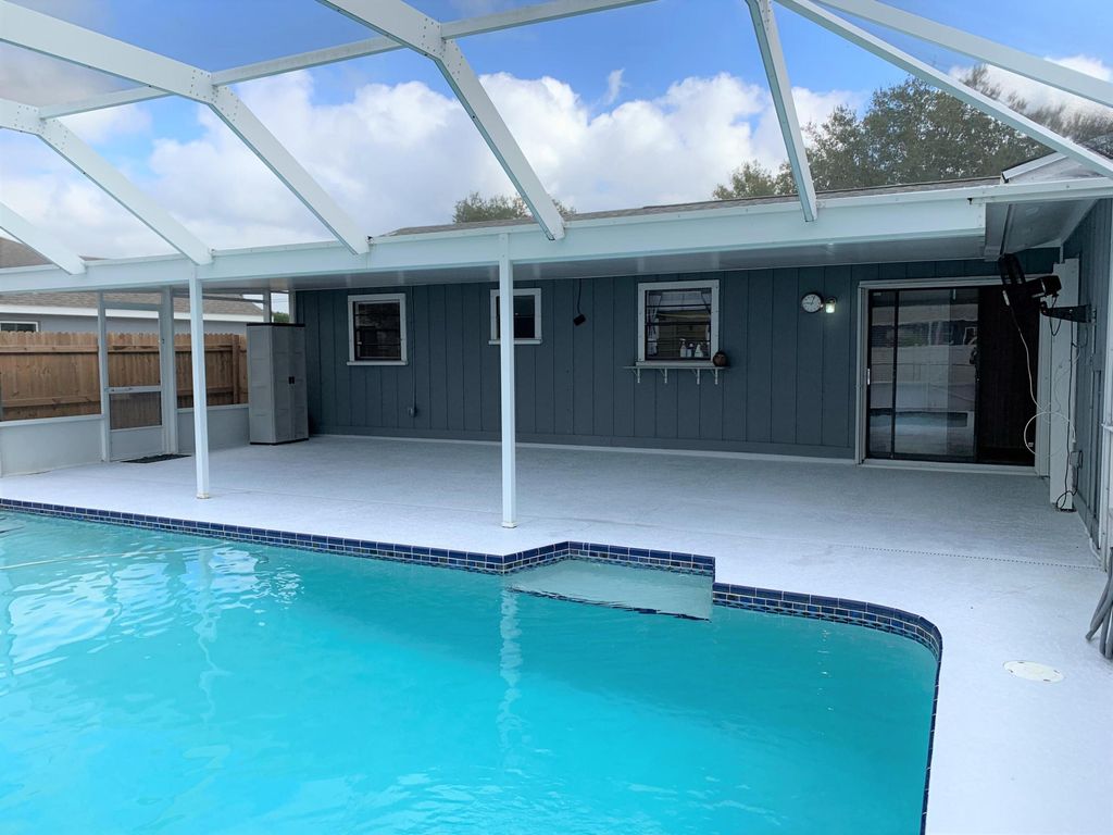 Photo of 826 SW Curtis Street, Port Saint Lucie, FL 34983 (MLS # R10968581)