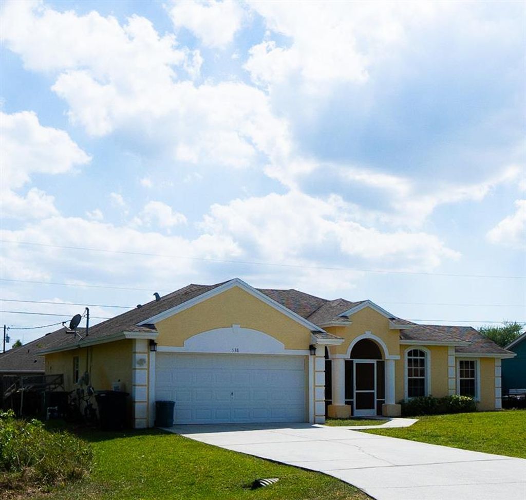 Photo of 538 SW Laconic Avenue Ave, Port St Lucie, FL 34953 (MLS # R10701455)