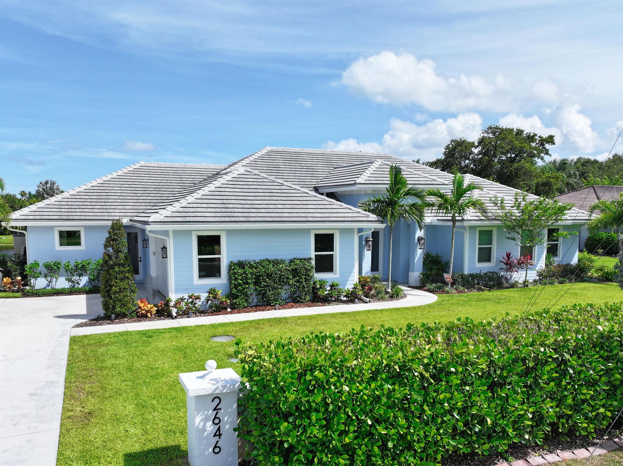 Architect-Designed Luxury Estate-5 BR, 4 Ba half acre Lake Front No HOA Built in 2022. Discover this custom-designed estate on a private half acre waterfront lot in a prestigious non-HOA enclave of Stuart, FL. The residence offers over 4,099 total SF of refined living, combining high-end design w/functional flexibility. Thoughtfully designed for multi-generational living, the home features a fully private in-law suite w/ a dedicated entrance, full bath, step in closet, laundry room, kitchenette, & scr'd patio. It's ideal for family, guests, or future rental flexibility. Gourmet Kit & designer finishes incl. Thermador Appl-Quartz Countertops & Prep Sink-Walk-In Pantry-Driftwood-Style Tile Throughout-Crown Molding & Impact glass-Dual zone A/C & Tankless Gas water heater. RV & BOAT space