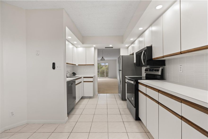 Experience the vibrant, active South Florida lifestyle in this beautifully updated 2-bedroom, 2-bathroom condo. Freshly repainted and meticulously maintained, this bright, spacious unit offers serene pond views from your private, enclosed patio. Enjoy a premier, resort-style living with Wynmoor's amenities: 18-hole golf, massive clubhouse/theater, fitness center, tennis, pickleball, and 19+ pools. A courtesy bus is included. The big, bright layout is perfect for entertaining. Low HOA fee includes many services. Move-in ready! A true opportunity in this desirable, gated 55+ community. Schedule your showing and start living the dream! Seller is flexible and open to reasonable offers.