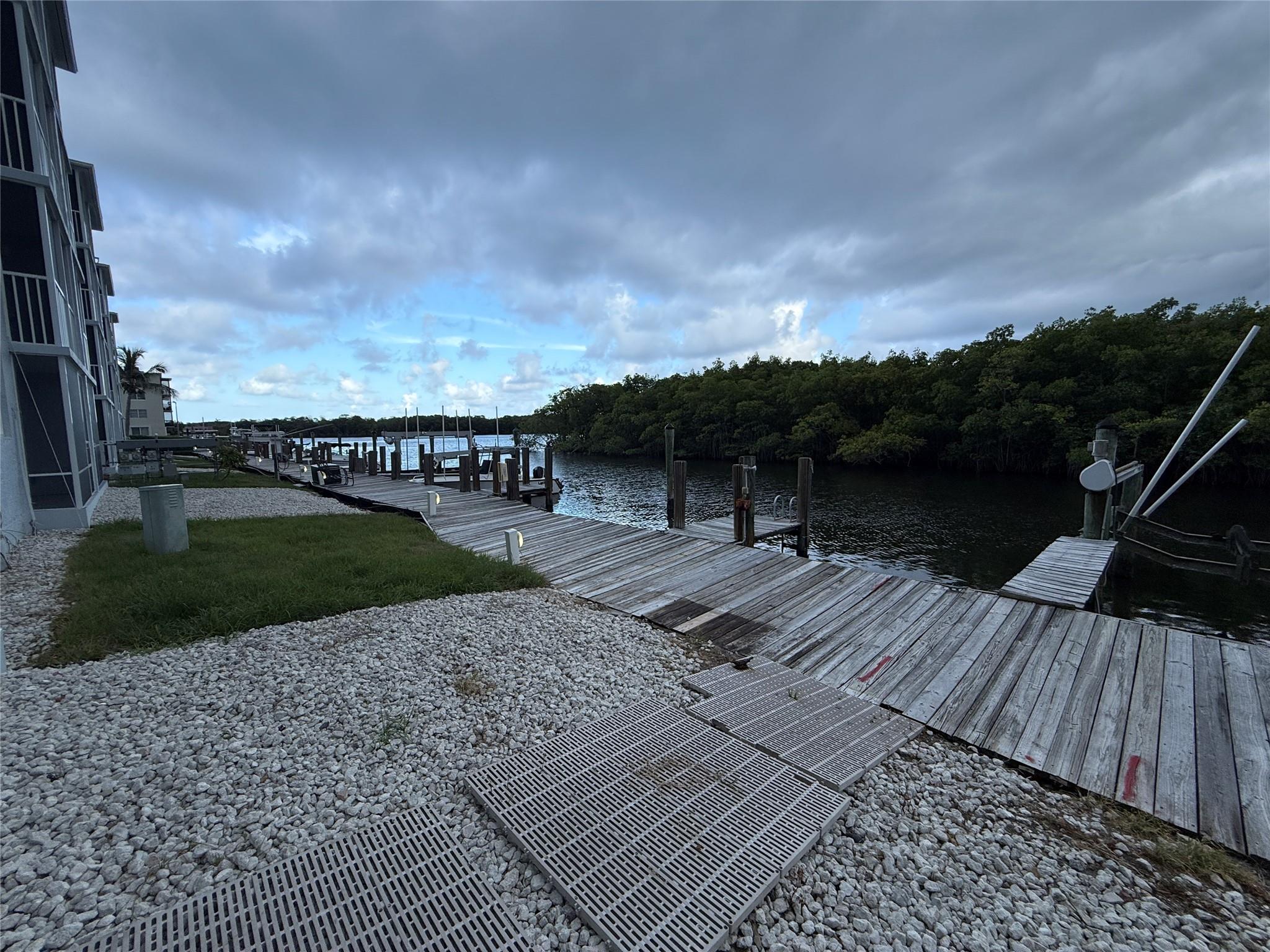 Beautifully updated 2BR / 2BA first-floor unit at Harbour Hall with direct Intracoastal water views. The unit features brand-new luxury vinyl plank flooring, fresh paint throughout, and a screened-in patio that just underwent complete concrete restoration—like new! Enjoy a spacious layout with large bedrooms, including a primary suite with a walk-in closet. Washer/dryer hookups are provided inside the unit for your convenience; however, there is a common area laundry room available. Harbour Hall is an all-ages community known for its unbeatable location near dining, shopping, and the beach. Amenities include a community pool, tennis courts, assigned parking, and plenty of guest spaces. No pets. No boat slip included.