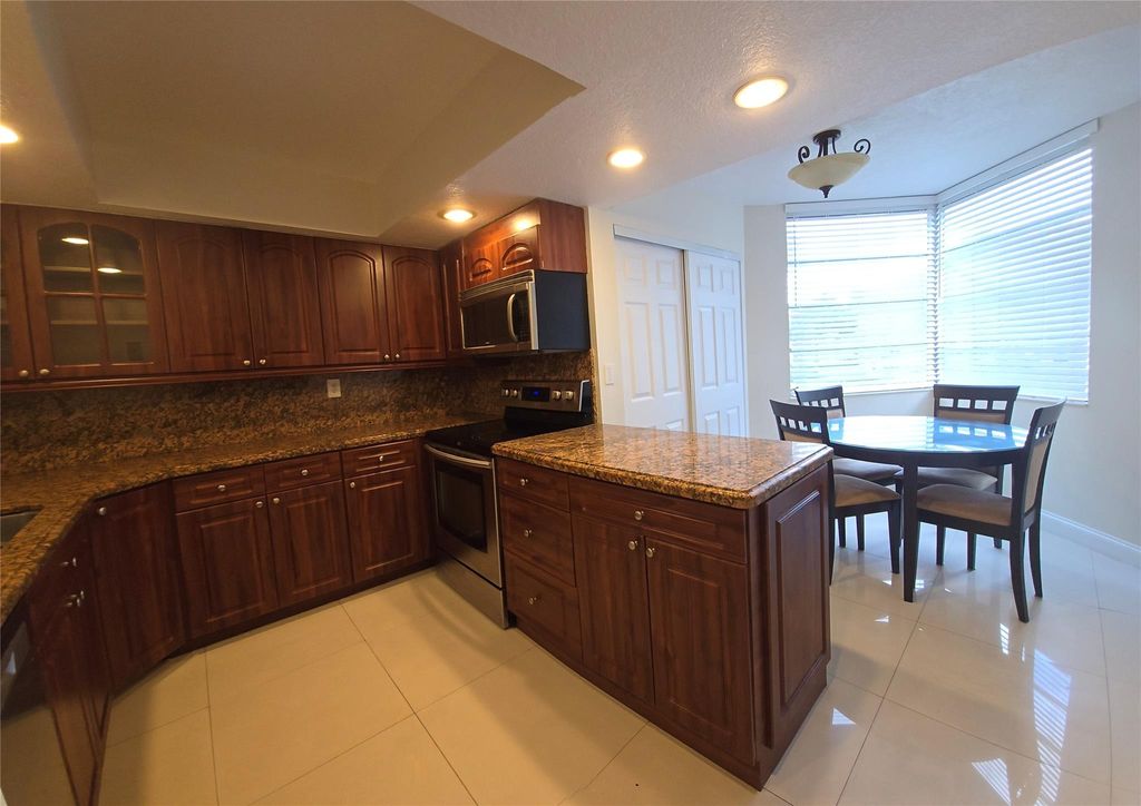 Photo of 1830 Sabal Palm Dr #206, Davie, FL 33324 (MLS # F10457552)