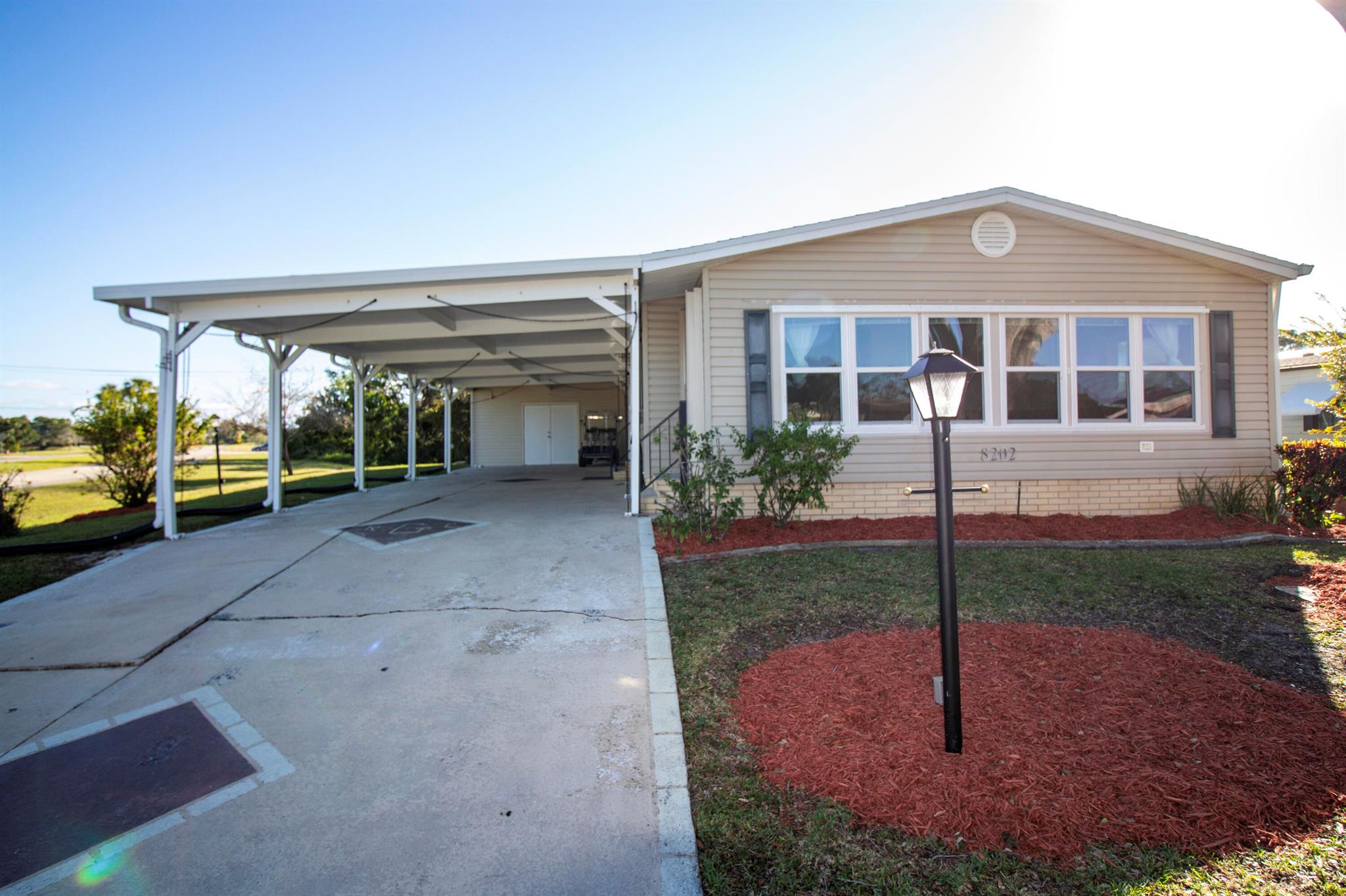 LAND OWNED, SAVING YOU THOUSANDS A YEAR ON LAND LEASE FEES! RARE 3 BEDROOM 2 BATH HOME IN DESIRABLE SAVANNA CLUB ON A CORNER LOT! BACKS TO A BEAUTIFUL PRESERVE, NO NEIGHBORS BEHIND YOU! HOME HAS RECENTLY UPGRADED KITCHEN WITH GRANITE AND SS APPLIANCES. NEW CARPET, FAMILY ROOM, ENCLOSED LANAI, COVERED PATIO AND BRAND-NEW ROOF 2024. HUGE DOUBLE WIDE CARPORT. PARK YOUR GOLF CART IN THE 17X14 SHED. ENJOY GOLF, TENNIS, BOCCE BALL, 3 CLUBHOUSES WITH POOLS AND SO MUCH MORE.