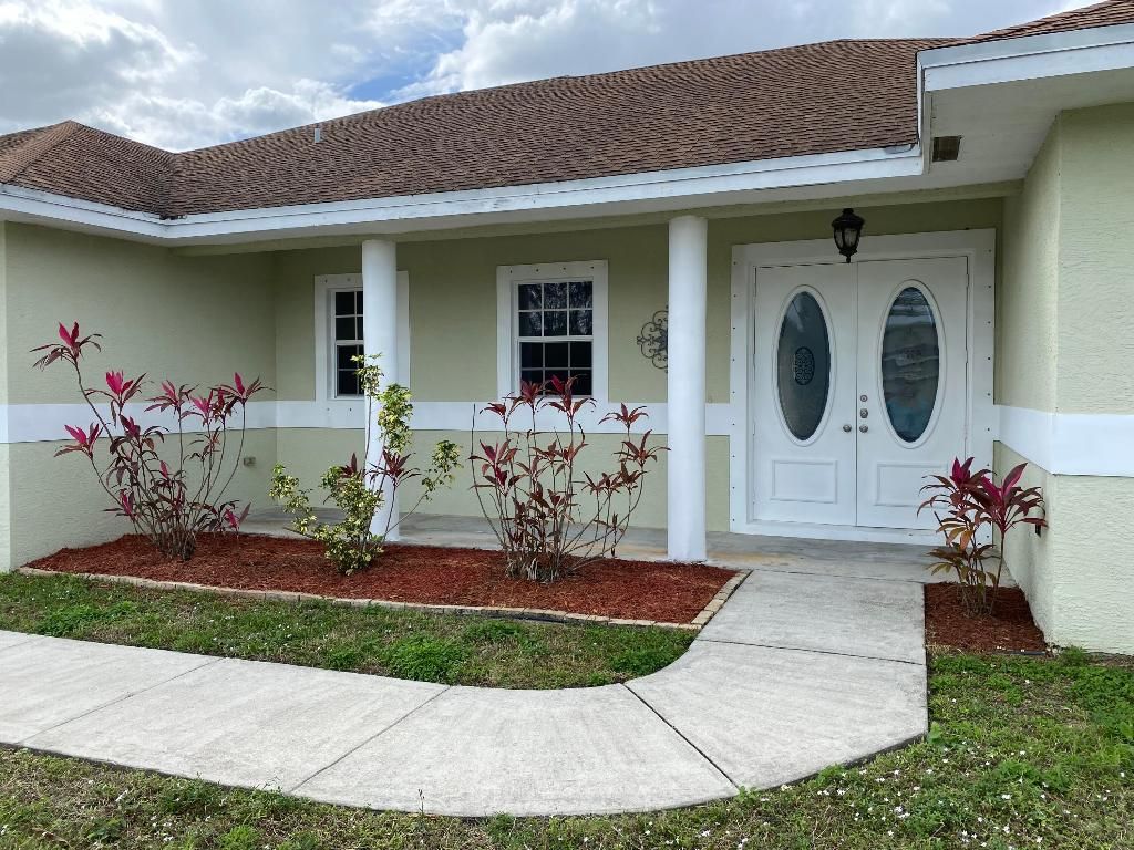Photo of 4012 SW Alice Street, Port Saint Lucie, FL 34953 (MLS # R10946527)