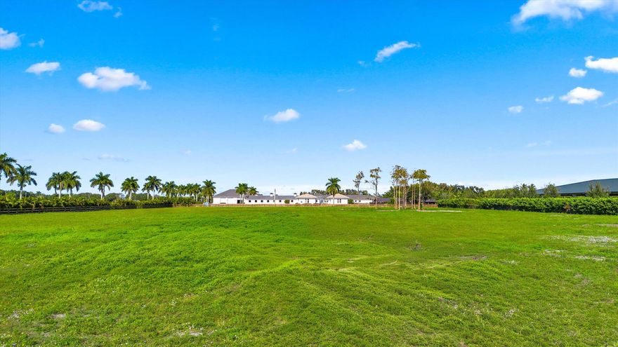Discover an unparalleled opportunity to own 5.2 acres of raw, build-ready land in the heart of Wellington, perfectly positioned just minutes from the world-renowned Winter Equestrian Festival and Global Dressage Festival. This rare offering combines privacy, prestige, and unbeatable accessibility to the epicenter of Wellington's equestrian lifestyle.