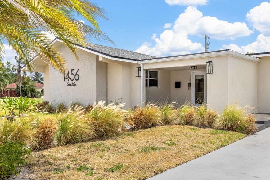 Freshly remodeled and just back on the market, this stylish 3 bed, 2 bath home at 1456 Cross Way offers resort-style living minutes from vibrant Downtown West Palm Beach. Completed in 2023, the full renovation includes a new roof, new AC, updated electrical and plumbing, and modern finishes throughout, giving you the peace of mind of a move? in ready home. The heart of the home is the open Concept living area and designer kitchen featuring a striking waterfall island and extended bar top "bit long" island, perfect for entertaining, casual dining, or working from home. A split floor plan places the primary suite on the opposite side of the house for added privacy, with two guest bedrooms and a second bath grouped together for convenient family or guest use.  Step outside to your new backyard oasis: a sparkling pool completed in December 2025, surrounded by fresh hardscape and green space ideal for lounging, grilling, and year-round outdoor living. Located in the Roosevelt Estates neighborhood, you are just a short drive to downtown dining, the waterfront, The Square, I95, and Palm Beach's world-class beaches. West Palm Beach is recognized as Palm Beach County's fastest?growing large city, with strong population and economic growth driving demand for updated, centrally located homes like this one. Offered for sale by owner, this beautifully upgraded property delivers modern comfort, a brand-new pool, and an unbeatable location in one of South Florida's most dynamic cities.