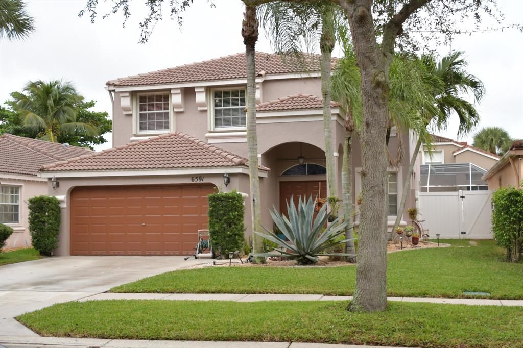 Photo of 6591 Columbia Avenue Ave #6591, Lake Worth Beach, FL 33467 (MLS # R10760380)