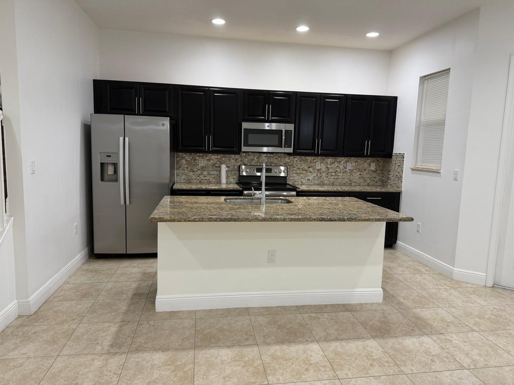 Photo of 12466 NW 17TH Court, Pembroke Pines, FL 33028 (MLS # B26066082)
