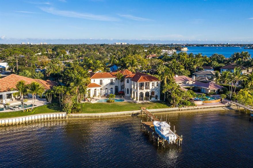 PANORAMIC WIDE RIVER VIEWS! The minute you drive through the gate you will be in your very own private oasis. This spectacular home is located one of the most sought-after streets in Tequesta Country Club. Wide river views are offered from nearly every room and the attention to detail flow through the entire home, from the sprawling staircase, to the marble and engineered wood floors, impact windows, to the wood beams in the formal living room and pecky cypress ceilings on outside patios.  Entertain family and friends at your summer kitchen and enjoy the the new refinished salt system pool overlooking your lushly landscaped yard. This home also features an elevator, large master suite with sitting area, his and her baths and private balcony overlooking the Loxahatchee River. See More.... The gourmet kitchen is perfect for entertaining, featuring stainless steel KitchenAid appliances, custom cabinetry, large cook island and breakfast bar. The family room features a custom built-in bar with 2 KitchenAid wine refrigerators. This impeccably maintained home is a must see! Just minutes to everything Jupiter and Tequesta have to offer. Generator does not work and buyer can replace at there expense.
All information is deemed reliable but not guaranteed.