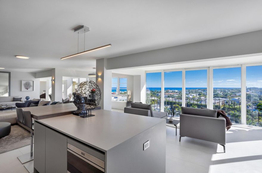 Two blocks from the ocean on vibrant Atlantic Avenue, Delray Beach, this totally renovated contemporary penthouse offers awe-inspiring ocean, Intracoastal and city views. Living like a chic city-loft showplace, spacious interiors establish a wonderful welcoming ambience, and a well-conceived layout emphasizes versatility and livability to suit a discerning owner's unique requirements.