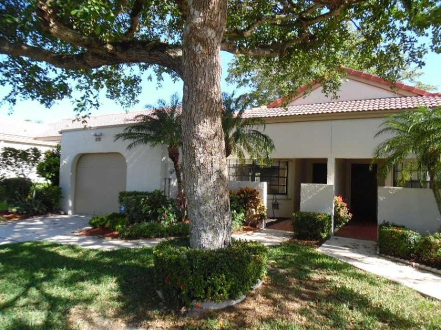 WOW!! So tastefully remodeled.. Classy 2 bedroom / 2 bathroom villa (1,296sf) with 1-car garage & enclosed Florida Room (239sf w/central A/C). Total sq.ft. under A/C = 1,535. Brand New Chef’s Kitchen with custom Solid Wood cherry maple cabinetry (cabinets & fronts); gorgeous “White Orchid” granite tops; classy marble backsplash in subway pattern with decorative inlays; under-mount counter lighting on dimmer; Brand New High-End Samsung Stainless Steel Appliances; (refrigerator is low-profile counter-depth); Both bathrooms have custom Solid Wood cherry maple vanities & “White Orchid” granite tops. 16” neutral ceramic tile and wood laminate flooring in bedrooms (NO CARPET). Brand New ceiling fans & light fixtures throughout. Split floor plan. Tranquil lake & garden view. The home is fully protected from hurricanes with Accordion & Electric Roll-Down Shutters. HOA is responsible for roofs, cable, building exteriors, building insurance, lawn maint./landscaping and recreation facilities. Manager on site. 3 resort style pools, Jacuzzi, clubhouse, fitness center, card and game rooms, tennis courts, daily activities, shows and numerous clubs. No mandatory equity membership to the Aberdeen country club.