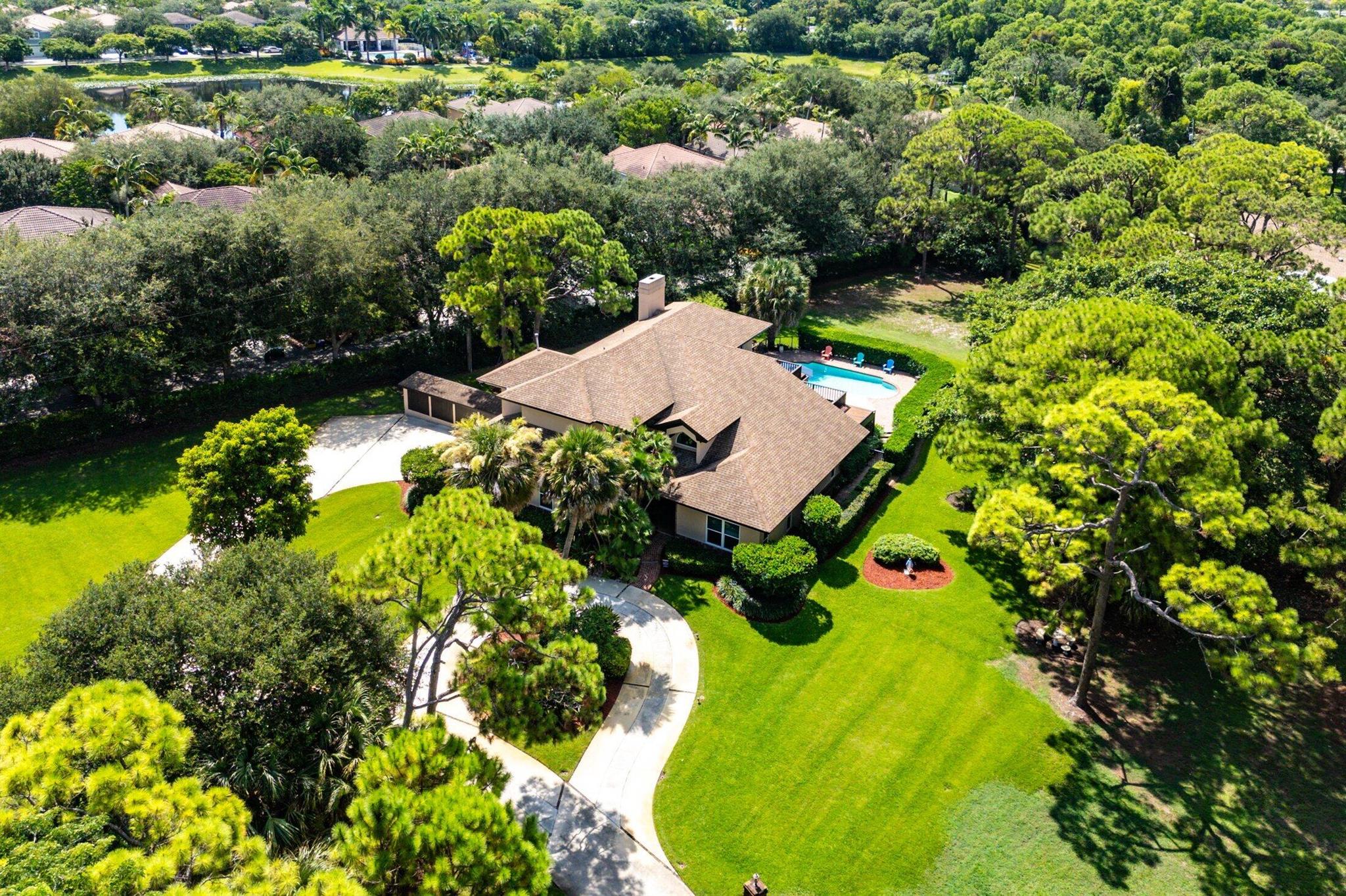 This property is a needle in a haystack and provides endless possibilities for the discerning purchaser seeking a special property available for the first time in over 40 years. The 3 acre property located just east of Military Trail seems an unlikely offering so near to downtown Delray Beach. The current residence is a classic, country-style, family home thoughtfully designed and maintained with 4 bedrooms, 4.5 bathrooms , pool, 2 car garage and mature pines and oaks. The sprawling 3 acre parcel includes a large utility structure for boat or camper storage in addition to a shed for tools, mower and equipment. The survey reflects a small pond on the North side of the property which acts as water retention while the majority of the property sits at or above 16'' Elevati