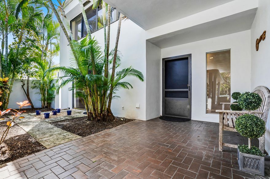 Welcome home to this spacious, end-unit, 3 bedroom, 3.5 bath townhome located just a few miles from the intracoastal, downtown West Palm Beach, and a stones throw from the popular Outlet Mall.  Home features beautiful Mexican tile, wet bar, updated bathrooms, eat-in kitchen, formal dining room, tons of storage, and a large master bath!  Enjoy your morning cup of brew outdoors in the entryway courtyard, on your private screened-in patio, or on the master bedroom balcony while taking in the long views of the Banyan Cay Golf Course!  No membership required and 1 cat or dog (under 50 lbs) is allowed in the family friendly community of Parliament Golf Villas.  Association covers exterior insurance, roof, landscaping, cable, internet, water, painting, and pressure cleaning. Hurry, will not last!