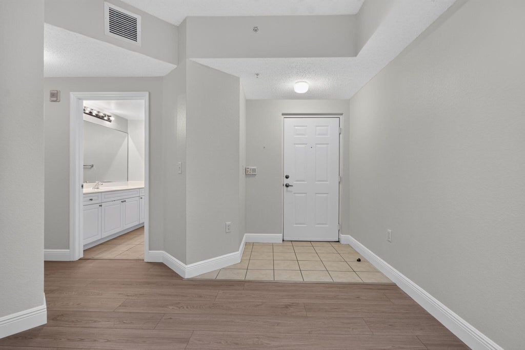 Photo of 3020 Alcazar Place, Palm Beach Gardens, FL 33410 (MLS # B26092218)