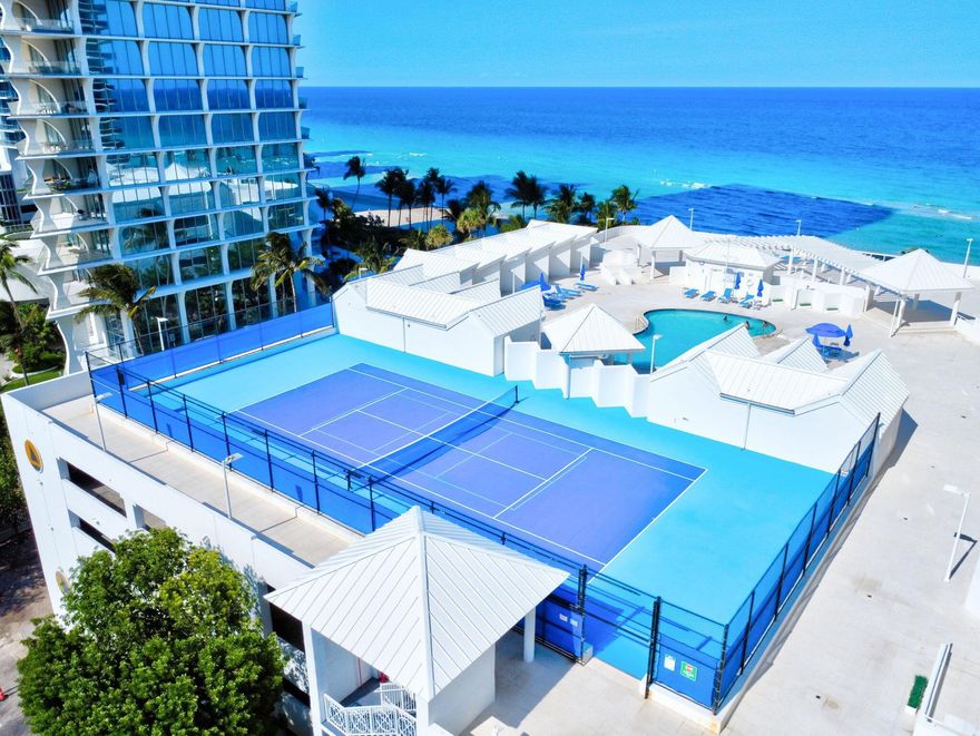 Discover elevated oceanfront living at Sands Pointe. This exquisite 2-bedroom, 2-bathroom residence spans 1,670 square feet in a prestigious 29-story tower rising above the pristine shores of Sunny Isles Beach. Step into a graciously appointed living and dining area, perfect for entertaining or relaxing in style. A sizable gourmet kitchen and charming breakfast nook overlook the Atlantic offering the perfect backdrop for your morning coffee or evening unwind. Porcelain floors throughout the bedrooms and bathrooms enhance the clean, modern aesthetic. The primary suite is a true sanctuary, boasting breathtaking ocean views, a custom walk-in closet, and a spa-inspired en suite bath.