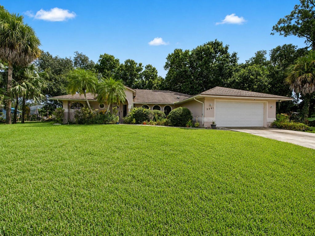 Photo of 2301 SW ABNER Road, Port Saint Lucie, FL 34953 (MLS # B26059222)