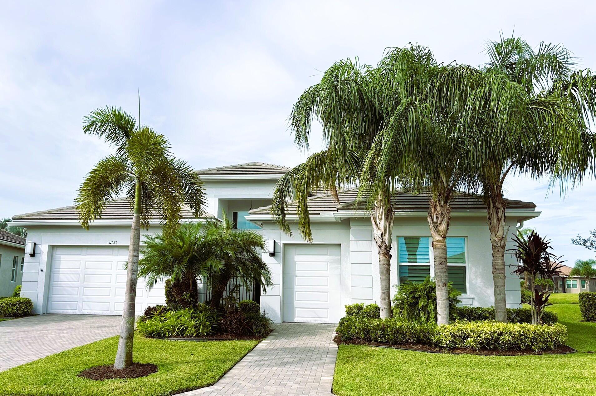 Welcome to this beautiful home located in Valencia Cay at Riverland in Port Saint Lucie. This popular Bianca model offers 2 bedrooms plus den and 3 full baths and 2 cars plus golf cart garage. With all of the elements you'd expect from a true luxury home from its open floorplan, well-appointed kitchen, inviting living areas, it also offers extensive custom trim, crown molding, custom paint colors and decor appointments throughout, nothing has been missed. The expanded screen lanai sits within an oversized fenced backyard, complete with views of wetlands and lake providing hours of relaxation watching Florida's beautiful native wildlife. Additionally, a powered awning has been added for those times when you desire a little extra shade. For p
