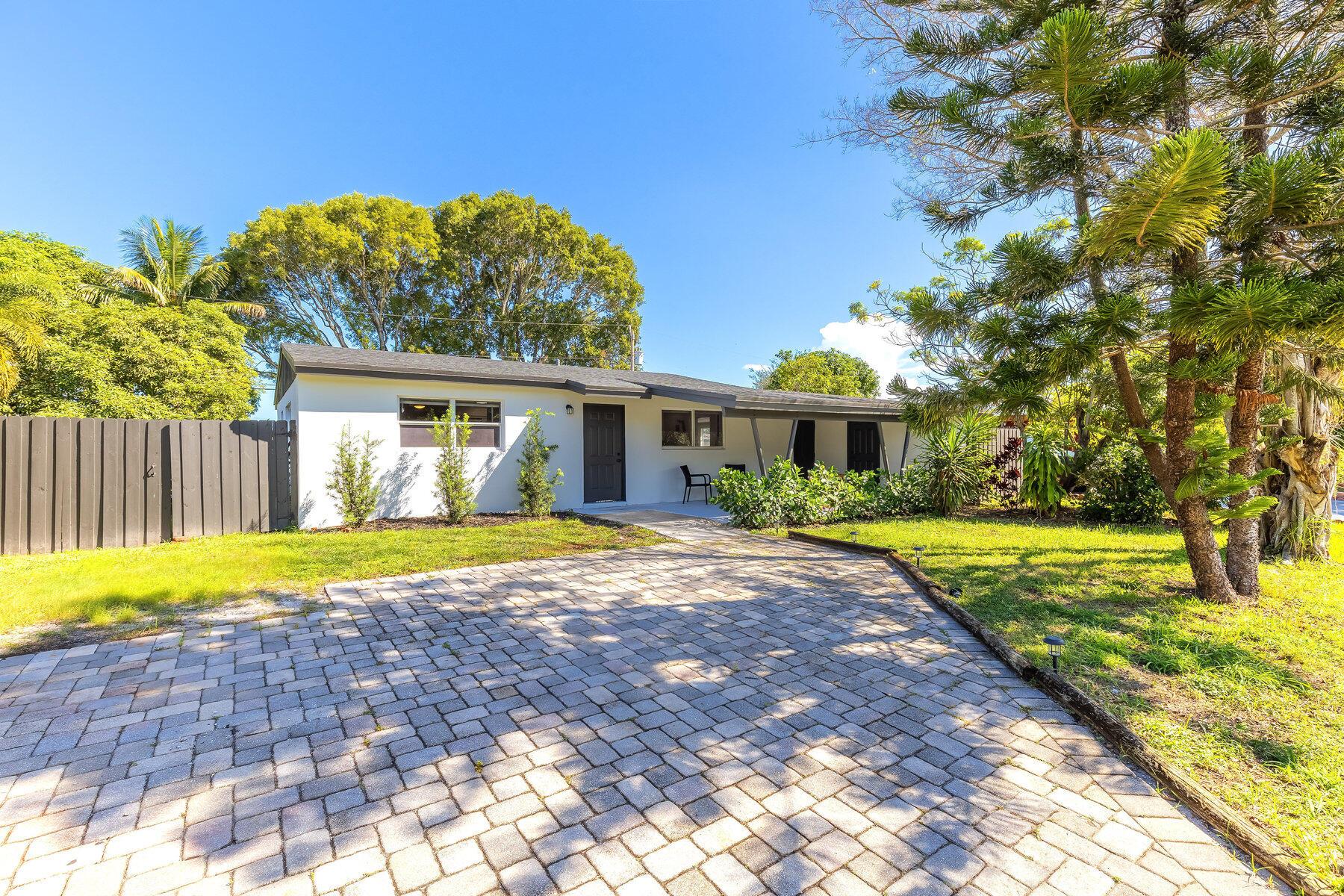 Welcome to 9148 Bamboo Drive, where style, space, and freedom meet in the heart of Palm Beach Gardens. This beautifully renovated 3-bedroom, 2-bath home offers 1,242 square feet of modern living with no HOA--so bring your boat, jet skis, RV, and pets. A 15-foot side gate provides easy access to the oversized backyard, offering plenty of room for storage, entertaining, or simply enjoying the Florida lifestyle. Plenty of room for a swimming pool!Inside, you'll find gorgeous renovations throughout, including a stunning kitchen with quartz countertops, white shaker cabinetry, and stainless steel appliances. The open layout features luxury vinyl flooring, updated bathrooms, creating a bright and inviting space.Enjoy peace of mind with a brand-new roof installed in 2024 and a generator