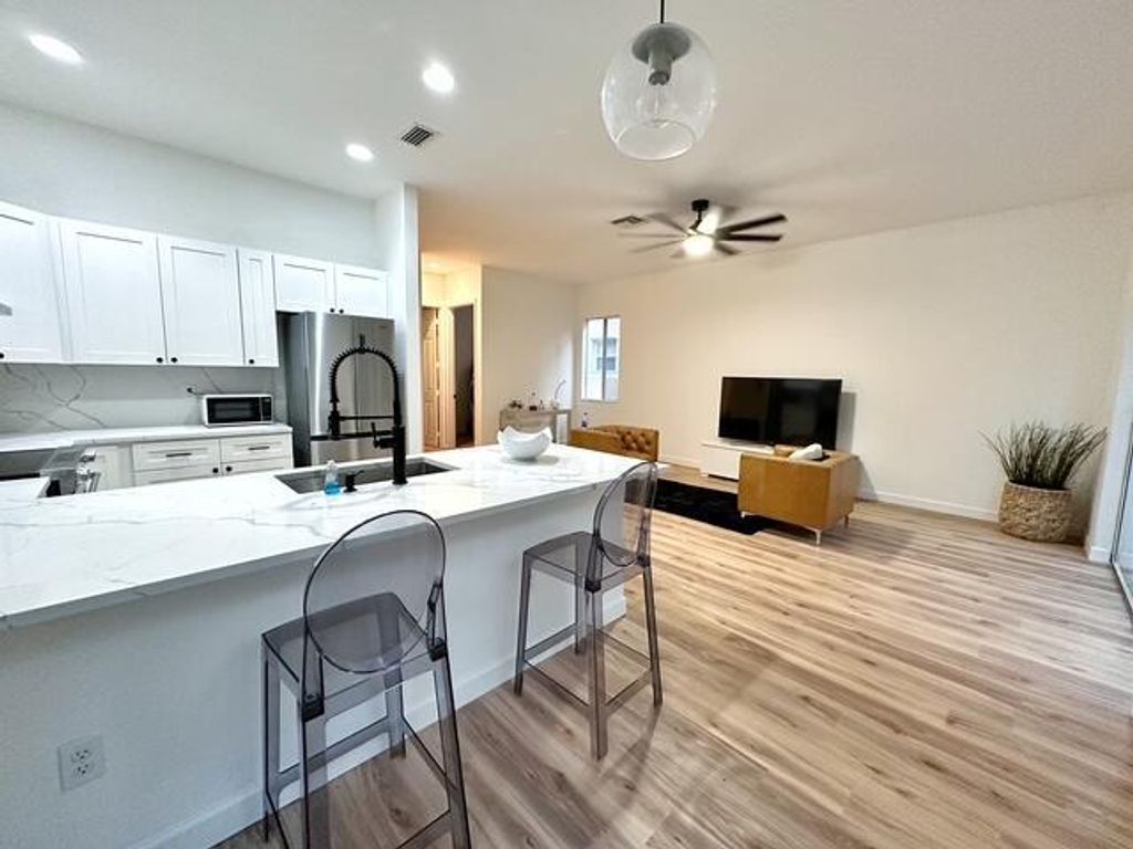 Photo of 121 Two Pine Drive, Greenacres, FL 33413 (MLS # R11051568)