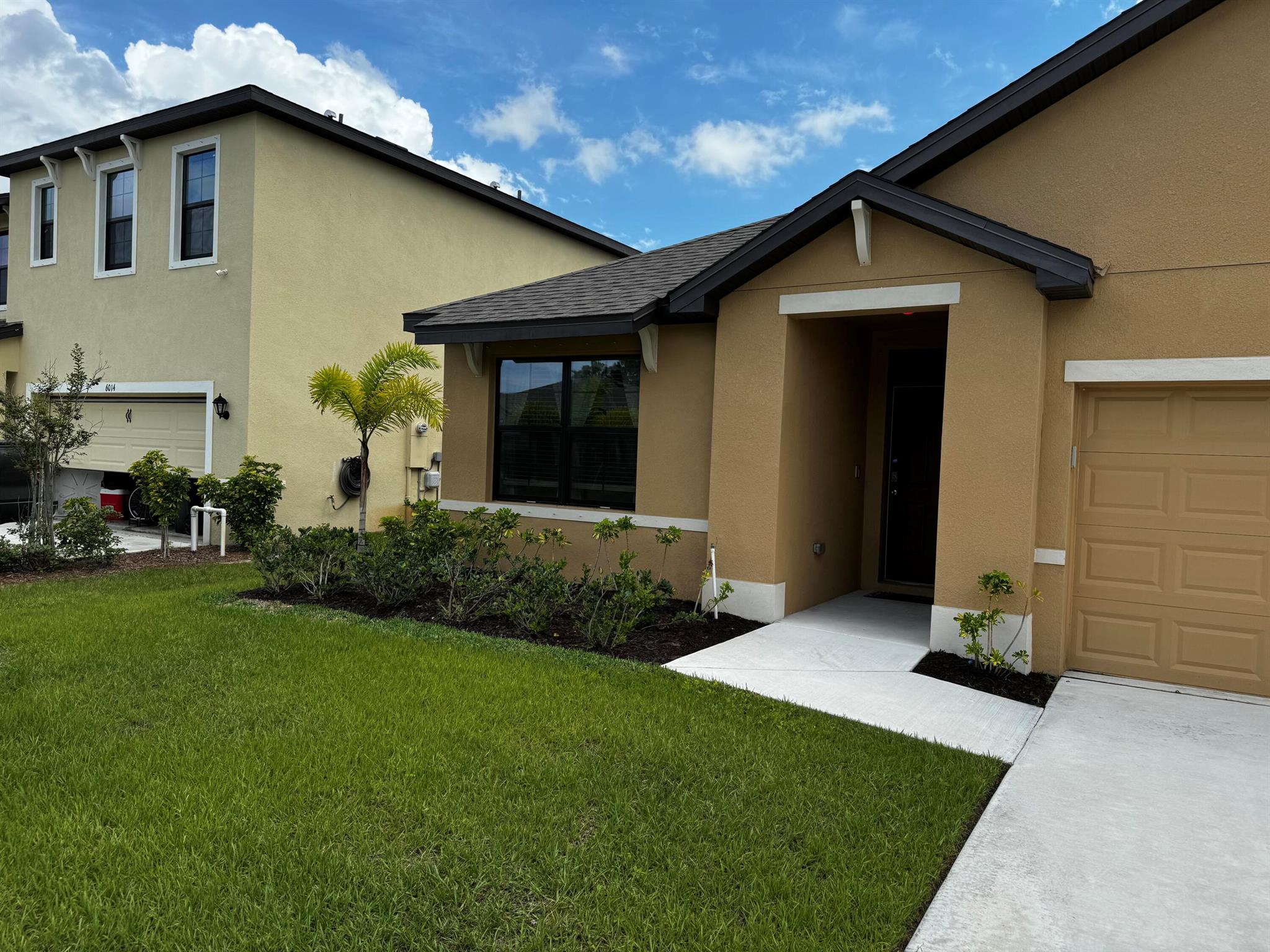 This charming 3-bedroom, 2-bathroom home offers 1,672 square feet of comfortable living space, meticulously designed for modern living. Constructed with sturdy all-concrete blocks, this single-story home emphasizes a spacious and efficient layout, perfect for both relaxation and entertaining.Interior Features:Open Concept Living: The heart of the home is its open concept kitchen, which seamlessly overlooks the living area, dining room, and extends to the covered lanai, enhancing indoor-outdoor living.Kitchen: The kitchen is a chef's delight with stainless steel appliances, a central island for prep and casual dining, and a walk-in pantry that provides ample storage for all your culinary needs.Living and Dining Areas: Centrally located, these areas are ideal for family gatherings