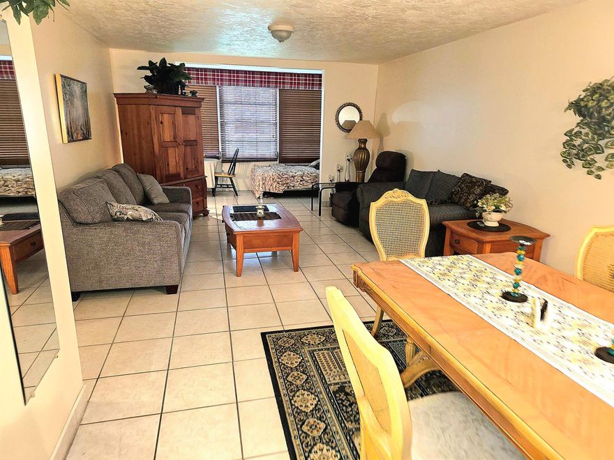 Your perfect retreat is ready! This 1BR/1BA feels like home the moment you walk in. Gleaming ceramic tile floors, open layout, and serene, quiet comfort in a secure gated 55+ community with manned security guard.  Vacation-style living every day: sparkling heated pool, clubhouse, billiards, shuffleboard, bocce, BBQ areas, library, fitness room, and lovely walking paths through tropical landscaping. Convenient to everything - Walmart, Publix, dining, banks - and just 15 mins to Fort Lauderdale Beach. Option to buy the furniture and move right in.