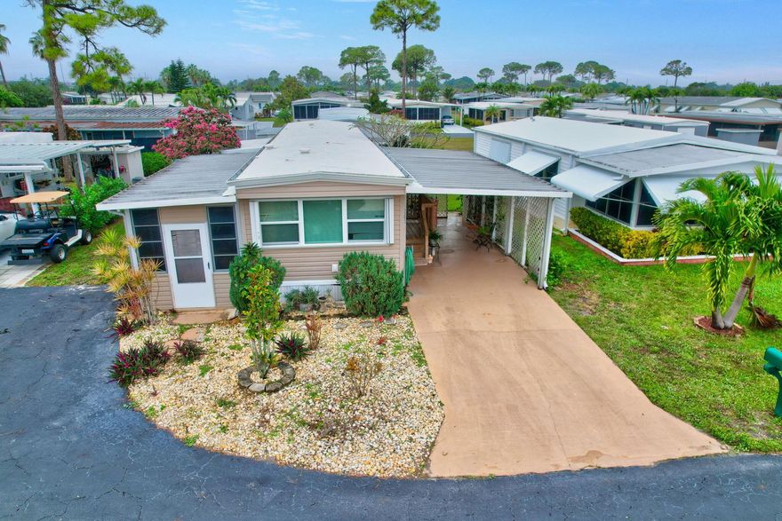 PRICED TO SELL! Located in sunny south Florida's premiere 55+ community of Jamaica Bay! This 2 bedroom, 2 bathroom home includes laminate flooring throughout, spacious open kitchen with granite countertops, new windows, accordion shutters, roof over and updated vinyl siding. Jamaica Bay's LOW monthly HOA fee of $250 covers internet, lawn care, water, sewer, trash removal, 24/7 manned gate, on-site management, and an abundance of amenities including multiple heated pools, library, clubhouse, billiards, putting green, shuffleboard, bocce ball, and plenty of social activities!