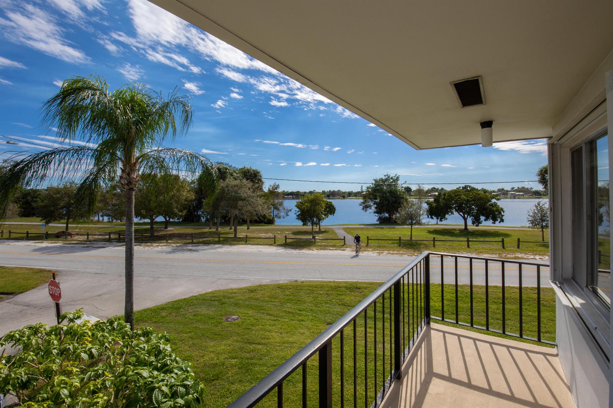 If you enjoy both nature and the ease of condo living then this is for you! Overlooking Lake Osborne and John Prince Park this lovely and updated corner unit has tons of windows for natural light and views, newer AC and water heater (2021). There is extra storage on the enclosed balcony. This condo is ready for you to move in as seller would prefer to sell furnished.