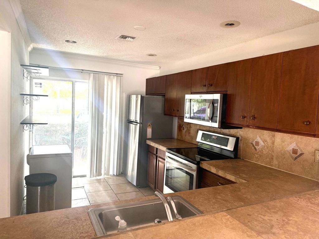 Photo of 795 Crystal Lake Drive #795, Deerfield Beach, FL 33064 (MLS # B26047254)