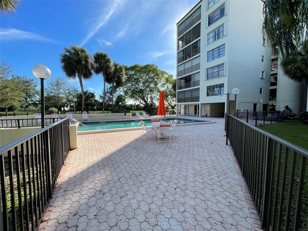 Photo of 2312 S Cypress Bend Drive #106, Pompano Beach, FL 33069 (MLS # F10411931)